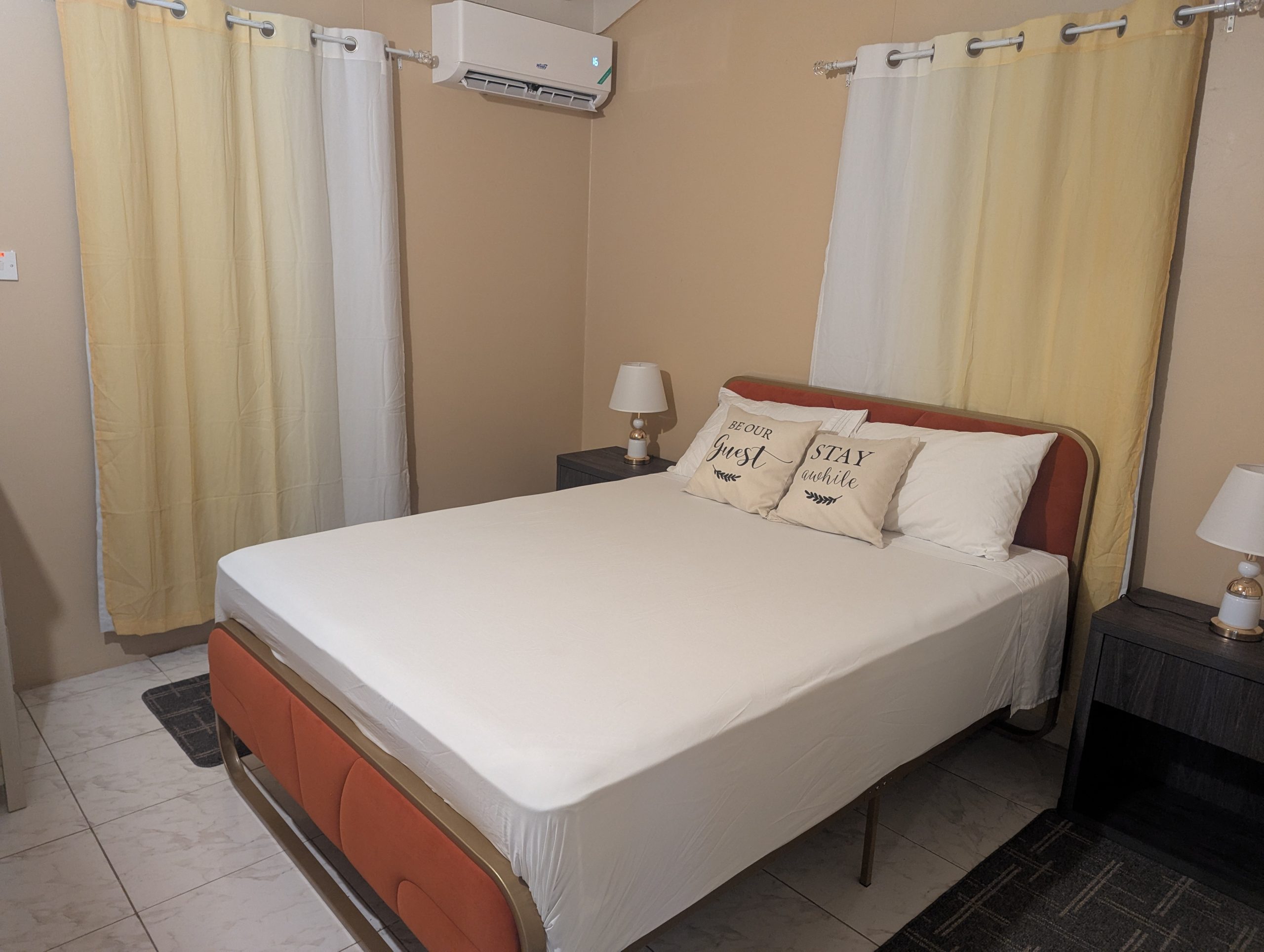 The second queen bedroom with warm bedding and air conditioning